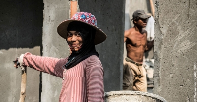A female construction worker on a building site in Cambodia