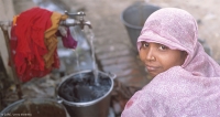 A woman collecting water in Utta Pradesh
