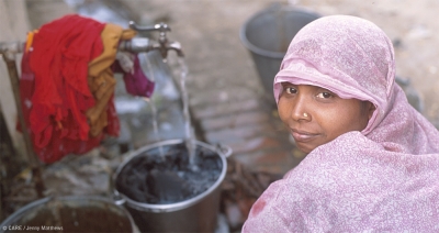 A woman collecting water in Utta Pradesh