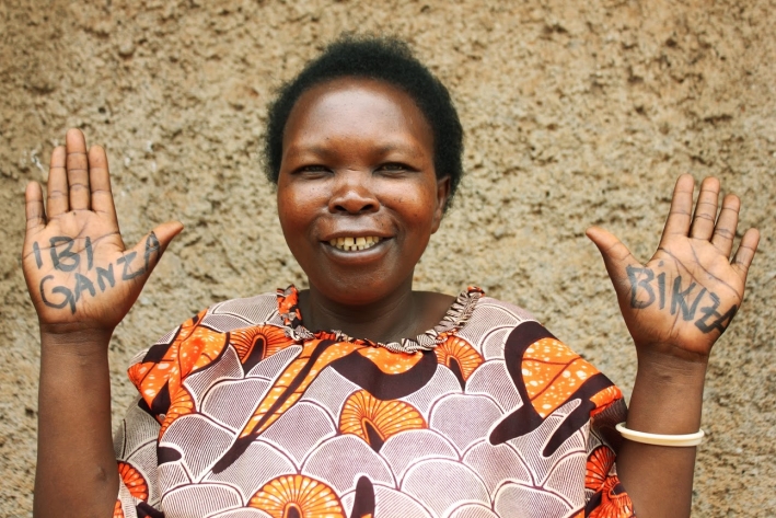 Ammpmcoata shows off her &lsquo;Powerful Hands&rsquo; (Ibuganza Birakiza in Kirwanda). She is a CARE VSLA member since 2007, in the village of Akagarama in Rwanda