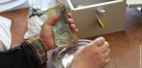 Women in Jordan participate in a savings and loan group supported by CARE