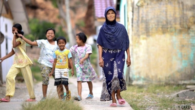 Ernawati, a woman in Indonesia who in the aftermath of the tsunami received a Family Survival Kit from CARE, and support in starting a small business which is now thriving