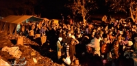 People queuing at the Serbia-Croatia border waiting to board buses to the camp of Opatovac inside Croatia, 21 October 2015