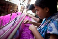 Women working in the garment industry in Bangladesh. &copy; CARE/Josh Estey