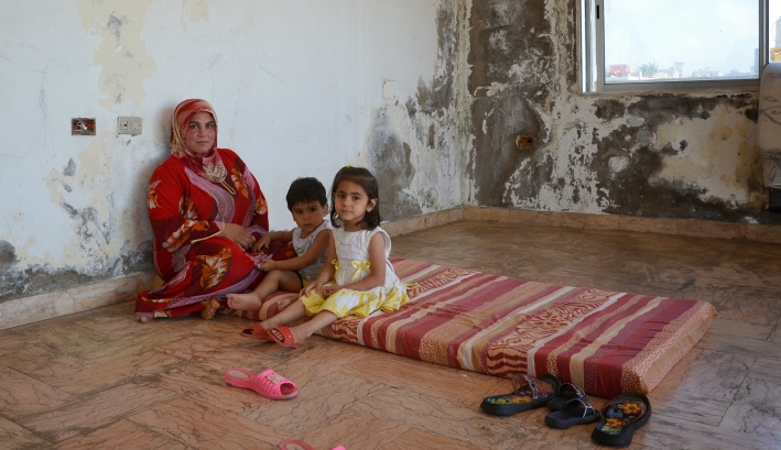 Syrian refugees living in a derelict building