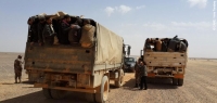 Syrian refugees being transferred from a temporary camp at the Syrian-Jordanian border to Zaatari camp in 2014