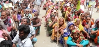 People queuing for assistance after floods in 2016