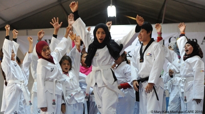 Girls from Syria take CARE-supported taekwondo class in Azraq refugee camp in Jordan