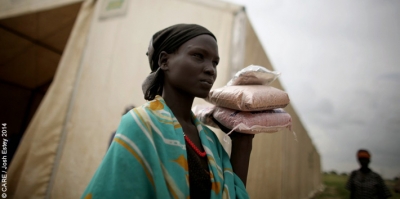 Martha Nyabar with packets of seeds distributed by CARE in South Sudan