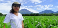 Reyna Araceli Reyes Sorto standing in a field of maize