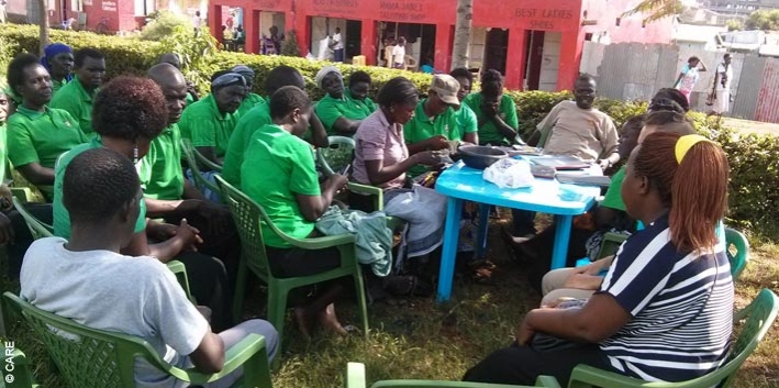 The Charcoal Sellers VSLA in Bondo, Kenya, conducts its weekly meeting. The group received a loan of approximately GBP 2,000 from Equity Bank, which members use to support their businesses, purchase equipment and pay school fees.