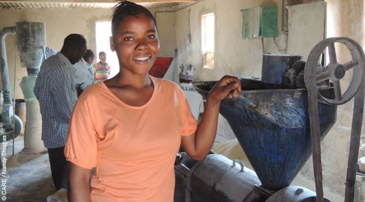 Nyangu Sakala, who was supported by a loan from Lendwithcare, runs a business grinding maize into flour and sunflower seeds into oil