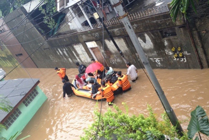 A rescue during flooding in Indonesia in January 2013. &copy; CARE / Paul Dixon