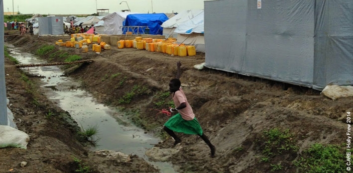 A girl leaving a CARE-constructed latrine at the UN Protection of Civilians site at Malakal, South Sudan