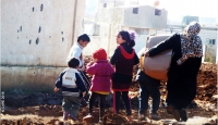 A family in Dara&rsquo;a governorate in southern Syria, where CARE is working with partners to deliver emergency supplies to more than 30,000 people