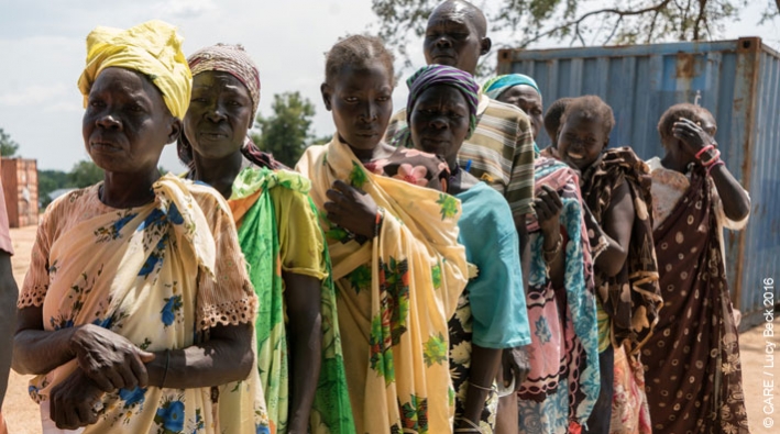 Residents of Torit, Eastern Equatoria, South Sudan, wait in line to receive an emergency aid distribution from CARE (November 2016)