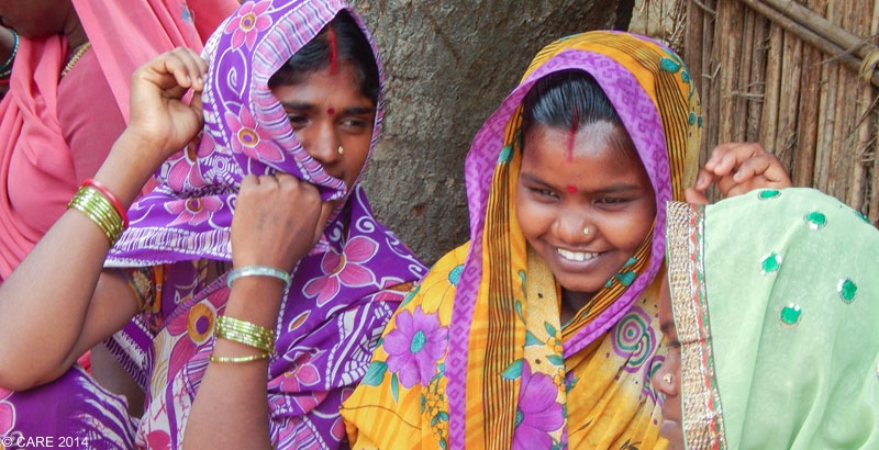 Young women in India discussing family planning methods at a CARE project