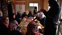 Syrian refugee women and local Jordanian women from the town of Azraq meet at a CARE-run community centre at Azraq camp, Jordan, for vocational training in jewellery-making and soap-making