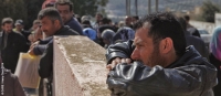 Syrians waiting for their initial interviews to register for assistance from CARE (photo taken in Jordan, February 2014)