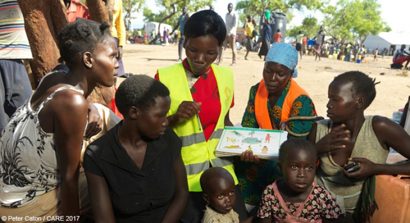 Mary, a CARE midwife, talks to refugees from South Sudan at Imvepi settlement, Uganda