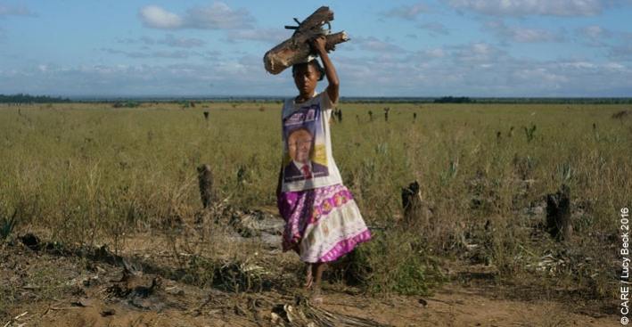 A woman crossing a field in Madagascar