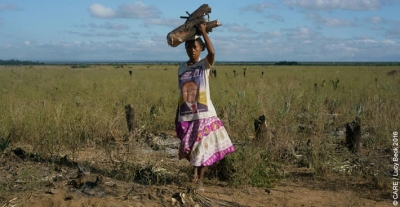 A woman crossing a field in Madagascar