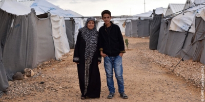 45-year-old Basema, pictured with her son Hussam, lives in Azraq refugee camp in Jordan with two of her sons. Her other two sons and her husband are in Germany and Turkey.