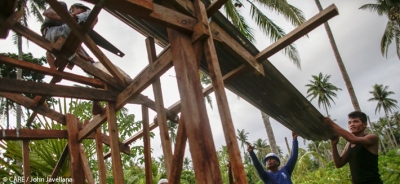 Mutuality, trust, and communications are key components to a good partnership - but how do we turn the rhetoric into reality? (Photo: a community in the Philippines rebuilds a house damaged by Typhoon Haiyan)