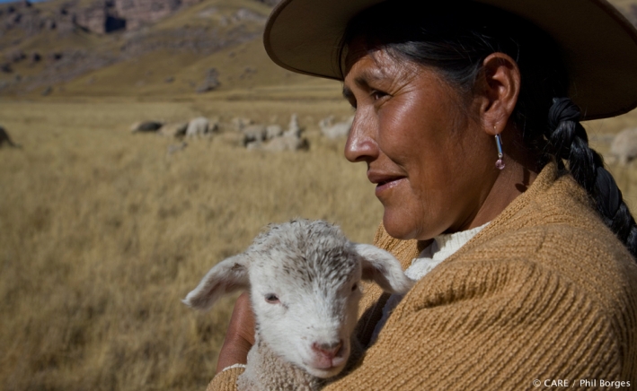 A Peruvian farmer with lamb