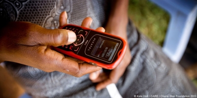 A woman member of a savings group in Kenya
