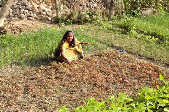 Supporting women smallholder farmers like this one is one of the most effective ways to tip the balance away from under-nutrition and poverty. &copy; CARE